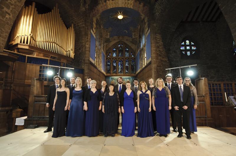 Formal group portrait in historic venue