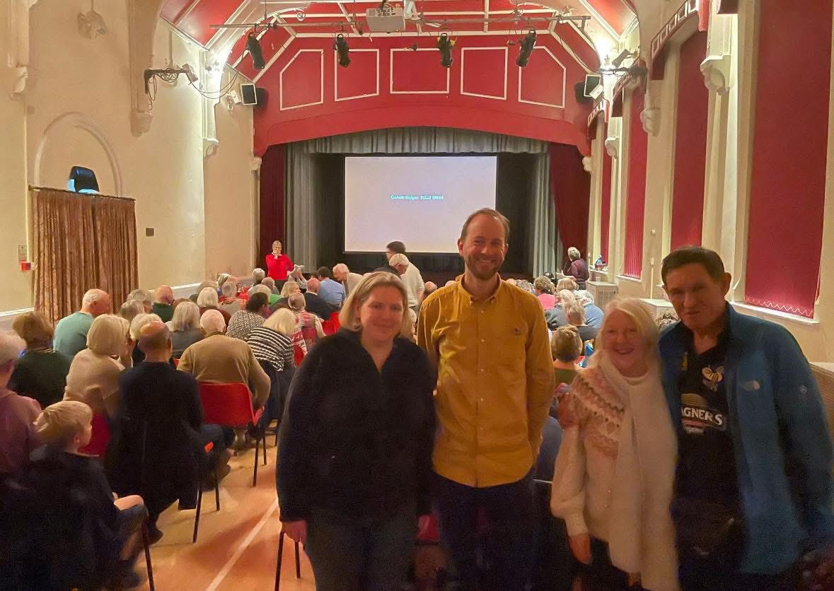Community gathering in historic hall